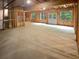 Unfinished basement with framing and an egress door, perfect for customization at 4345 Park Brooke Trce, Alpharetta, GA 30022
