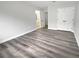 This bedroom features neutral walls, white doors, and durable, modern, light brown floors at 4345 Park Brooke Trce, Alpharetta, GA 30022