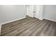 This bedroom features white doors, neutral walls, and durable, modern, light brown floors at 4345 Park Brooke Trce, Alpharetta, GA 30022