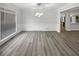 Bright dining room featuring stylish chandelier, large windows, and sleek hardwood floors at 4345 Park Brooke Trce, Alpharetta, GA 30022