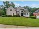 Charming two-story home with landscaped yard and a grand entranceway at 4345 Park Brooke Trce, Alpharetta, GA 30022