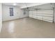 Clean and spacious garage with a large door and natural light, ideal for multiple vehicles at 4345 Park Brooke Trce, Alpharetta, GA 30022