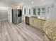 Spacious kitchen with an island featuring stainless appliances and granite countertops at 4345 Park Brooke Trce, Alpharetta, GA 30022