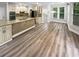 Large kitchen featuring white cabinets, stainless appliances, and an island at 4345 Park Brooke Trce, Alpharetta, GA 30022