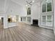 Bright, open living space with high ceilings, fireplace and large windows at 4345 Park Brooke Trce, Alpharetta, GA 30022