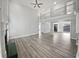 Open-concept living room boasting soaring ceilings, fireplace, and abundant natural light at 4345 Park Brooke Trce, Alpharetta, GA 30022