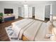 Spacious main bedroom featuring neutral colors, ensuite, and double closets at 4345 Park Brooke Trce, Alpharetta, GA 30022