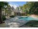 Beautifully designed backyard featuring a stunning pool, spa, sun loungers, and manicured landscaping, perfect for relaxing at 4375 Mount Paran Pkwy Nw, Atlanta, GA 30327
