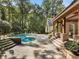 A backyard pool and outdoor kitchen area at 4375 Mount Paran Pkwy Nw, Atlanta, GA 30327