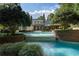 Expansive pool and spa area surrounded by lush greenery and brick walls, offering a serene outdoor experience at 4375 Mount Paran Pkwy Nw, Atlanta, GA 30327