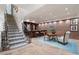 Finished basement with a bar, dining area, and access to the stairs at 4375 Mount Paran Pkwy Nw, Atlanta, GA 30327