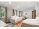 Bright bedroom with large windows, multiple beds, patterned rug, and a light-colored walls at 4375 Mount Paran Pkwy Nw, Atlanta, GA 30327