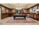 Billiard room features a pool table, area rug, chandelier, and wood paneled walls at 4375 Mount Paran Pkwy Nw, Atlanta, GA 30327