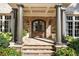 Grand front entrance features stately columns, stone facade, and an elegant arched wooden door at 4375 Mount Paran Pkwy Nw, Atlanta, GA 30327