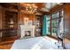 Wood-paneled office with a fireplace, built-in bookshelves, and a large window with a view at 4375 Mount Paran Pkwy Nw, Atlanta, GA 30327