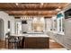 Gourmet kitchen with wood ceiling beams, marble countertops, and stainless steel appliances at 4375 Mount Paran Pkwy Nw, Atlanta, GA 30327