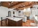 Stunning kitchen featuring a large island with seating, modern appliances, and wooden beams at 4375 Mount Paran Pkwy Nw, Atlanta, GA 30327