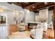 Elegant living room with wooden floors, coffered ceiling, fireplace, and a staircase at 4375 Mount Paran Pkwy Nw, Atlanta, GA 30327