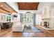 Bright living room with stone fireplace, hardwood floors, and backyard views at 4375 Mount Paran Pkwy Nw, Atlanta, GA 30327