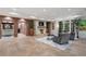 Open living room with stone fireplace, exposed brick, and comfortable seating at 4375 Mount Paran Pkwy Nw, Atlanta, GA 30327