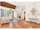 Spacious living room with hardwood floors, stone fireplace, large windows, and elegant decor at 4375 Mount Paran Pkwy Nw, Atlanta, GA 30327
