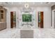Luxurious main bathroom features a soaking tub, dual shower, marble floors and an amazing outside view at 4375 Mount Paran Pkwy Nw, Atlanta, GA 30327