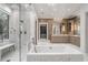 The luxurious main bathroom features a soaking tub, walk-in shower, double vanities and an adjacent walk in closet at 4375 Mount Paran Pkwy Nw, Atlanta, GA 30327
