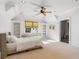 Bedroom with carpet, window seat, built-in bookshelves, and a door leading to an ensuite bathroom at 4375 Mount Paran Pkwy Nw, Atlanta, GA 30327