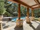 Covered patio with stone pillars overlooking a large pool at 4375 Mount Paran Pkwy Nw, Atlanta, GA 30327