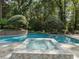 Inviting backyard pool featuring a modern tiled hot tub and mature landscaping for a private oasis feel at 4375 Mount Paran Pkwy Nw, Atlanta, GA 30327