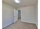 Comfortable bedroom with plush carpeting and neutral walls, creating a cozy atmosphere at 516 N Shore Rd, Lithonia, GA 30058