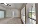 Spacious bedroom with plush carpeting and large windows at 516 N Shore Rd, Lithonia, GA 30058