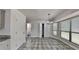 Eat-in kitchen area filled with natural light, featuring a chandelier and a view of the backyard at 516 N Shore Rd, Lithonia, GA 30058