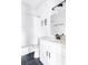 Bright bathroom with a tub and shower, white subway tile, and black fixtures at 569 Hope Sw St, Atlanta, GA 30310