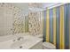 bathroom featuring a blue and yellow striped shower curtain and fish wallpaper at 980 Ector Chase Nw, Kennesaw, GA 30152