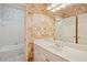 Bathroom featuring floral wallpaper, a soaking tub and a white vanity at 980 Ector Chase Nw, Kennesaw, GA 30152
