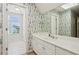 Primary bathroom featuring double vanity, tiled floor, and garden-style window at 980 Ector Chase Nw, Kennesaw, GA 30152