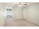 Empty bedroom with light green walls, neutral carpet, and a window at 980 Ector Chase Nw, Kennesaw, GA 30152