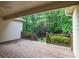 Wooden deck overlooking a lush backyard with mature trees and landscaping at 980 Ector Chase Nw, Kennesaw, GA 30152