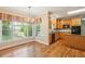 Bright eat-in kitchen with wood floors, chandelier, and stainless appliances at 980 Ector Chase Nw, Kennesaw, GA 30152