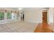Spacious living room featuring neutral carpet, hardwood, and large windows at 980 Ector Chase Nw, Kennesaw, GA 30152