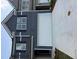 Home exterior with a light grey and dark grey siding, and a white garage door at 1122 Edinberg Dr, Villa Rica, GA 30180