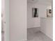 Upstairs hallway with neutral paint and carpet accented by modern art on the walls at 1122 Edinberg Dr, Villa Rica, GA 30180