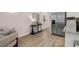 Living room area and stainless steel refrigerator at 1122 Edinberg Dr, Villa Rica, GA 30180