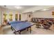 Basement with a ping pong table, furniture, and door leading outside at 130 River Ne Lndg, Sandy Springs, GA 30350