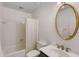 Traditional bathroom with a shower-tub combo, classic fixtures, and neutral tile at 130 River Ne Lndg, Sandy Springs, GA 30350