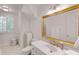 Elegant bathroom featuring a large mirror, white vanity and classic fixtures at 130 River Ne Lndg, Sandy Springs, GA 30350