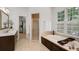 Bathroom with a large soaking tub, a separate shower, and a dark wood vanity with a sink at 130 River Ne Lndg, Sandy Springs, GA 30350