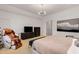 Well lit bedroom featuring a plush carpet, light walls, and sleek furniture at 130 River Ne Lndg, Sandy Springs, GA 30350