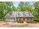 Charming home with a well-manicured front yard, garage, and inviting entrance at 130 River Ne Lndg, Sandy Springs, GA 30350